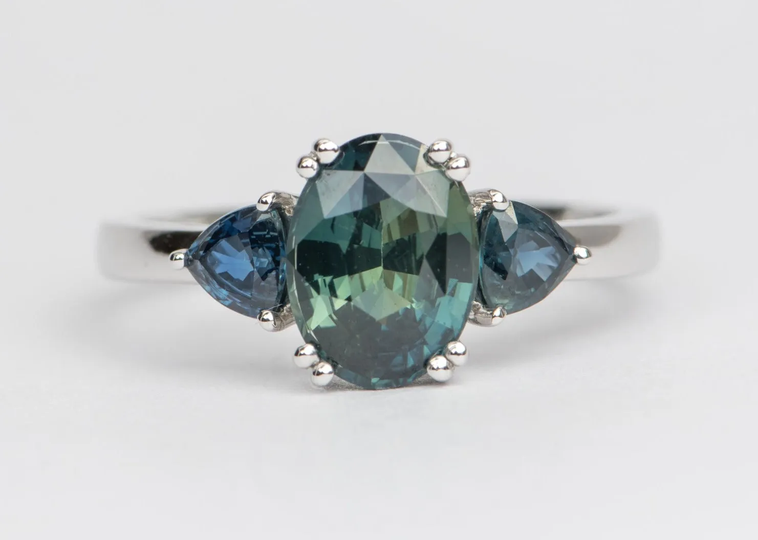 2.85 carat teal sapphire 3-stone white gold engagement ring