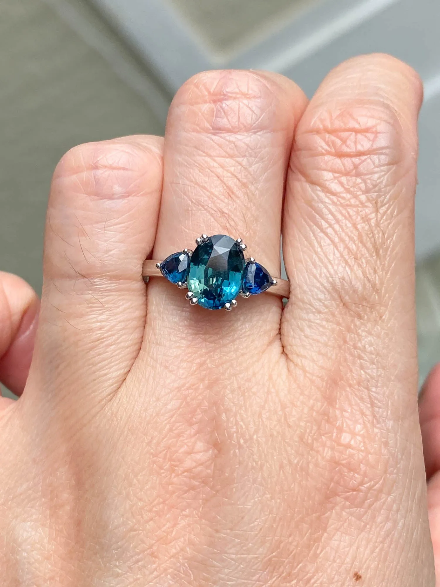 2.85 carat teal sapphire 3-stone white gold engagement ring