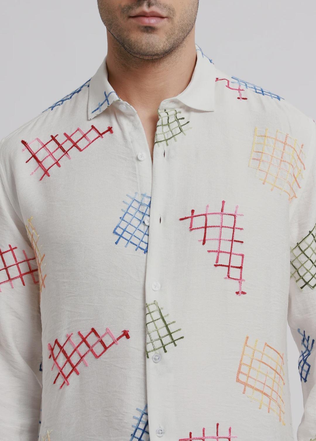 white embroidered shirt with geometric pattern