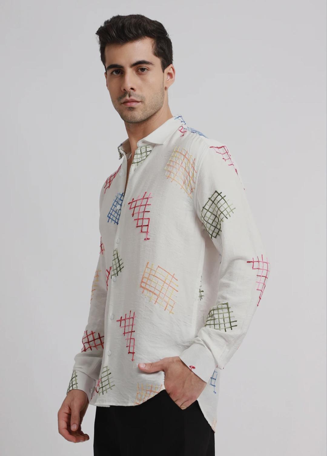 white embroidered shirt with geometric pattern